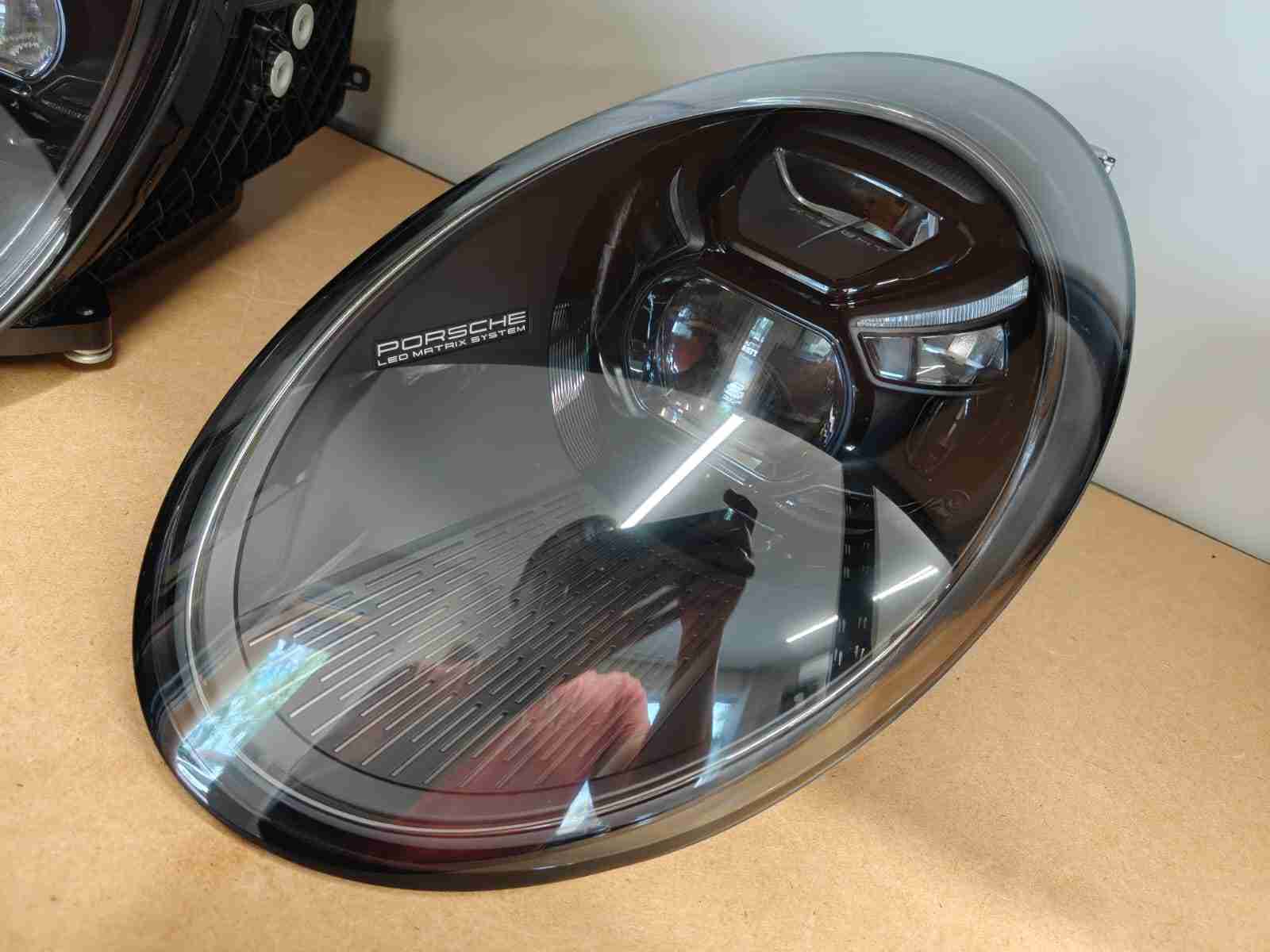 Фара левая Porsche 911 060826-204