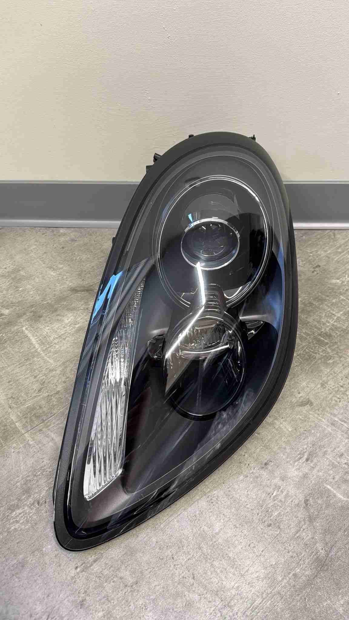 Фара левая Porsche Cayman 190226-112