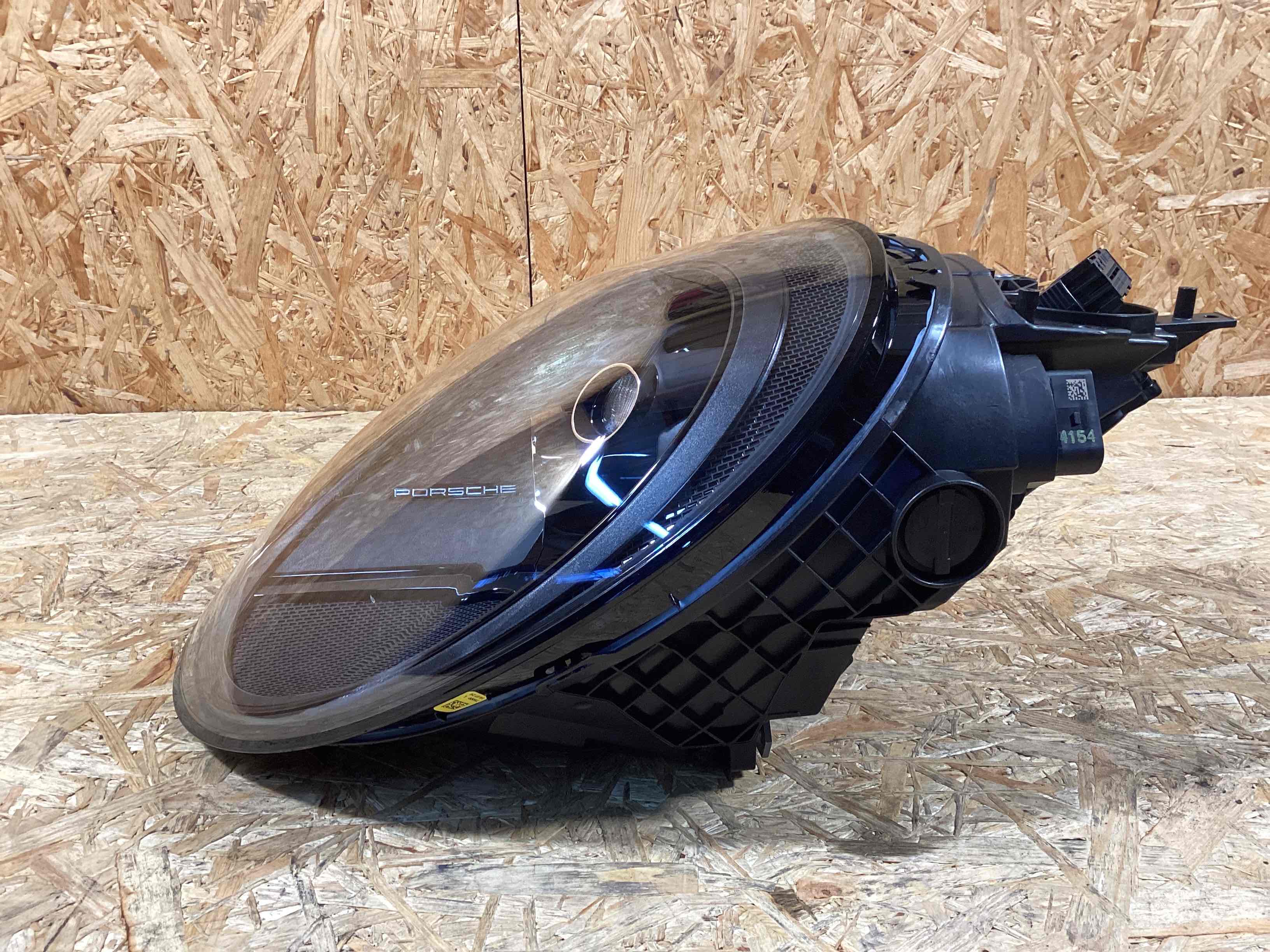 Фара левая Porsche 911 200225-118